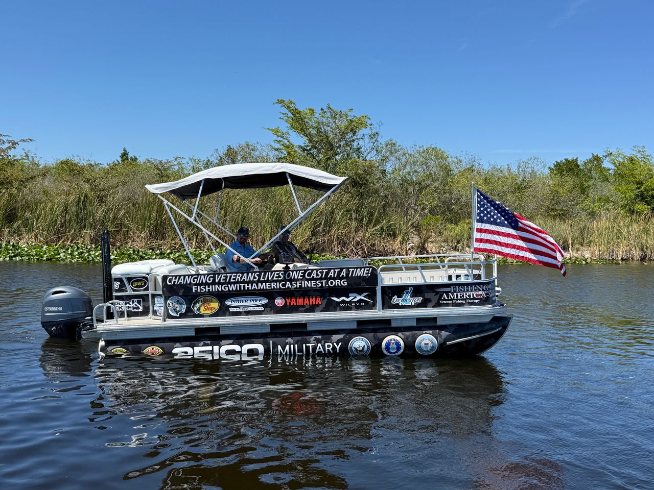Boat on water with American flag and Seiko Military branding